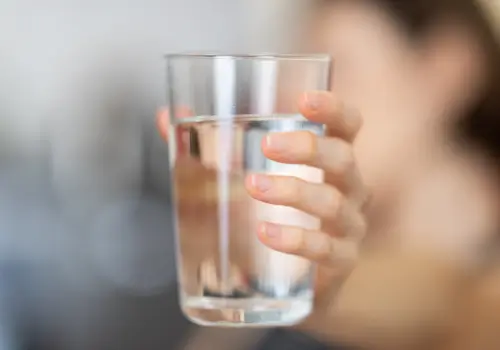 holding-a-glass-of-water